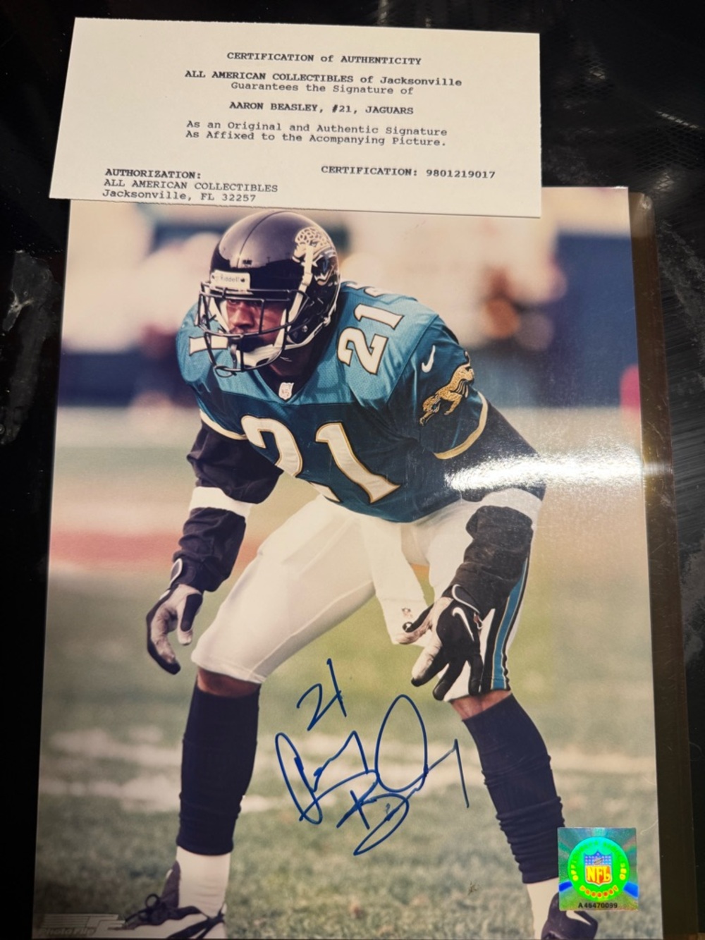 Autographed Aaron Beasley #21 Football Photo in Teal & Black
